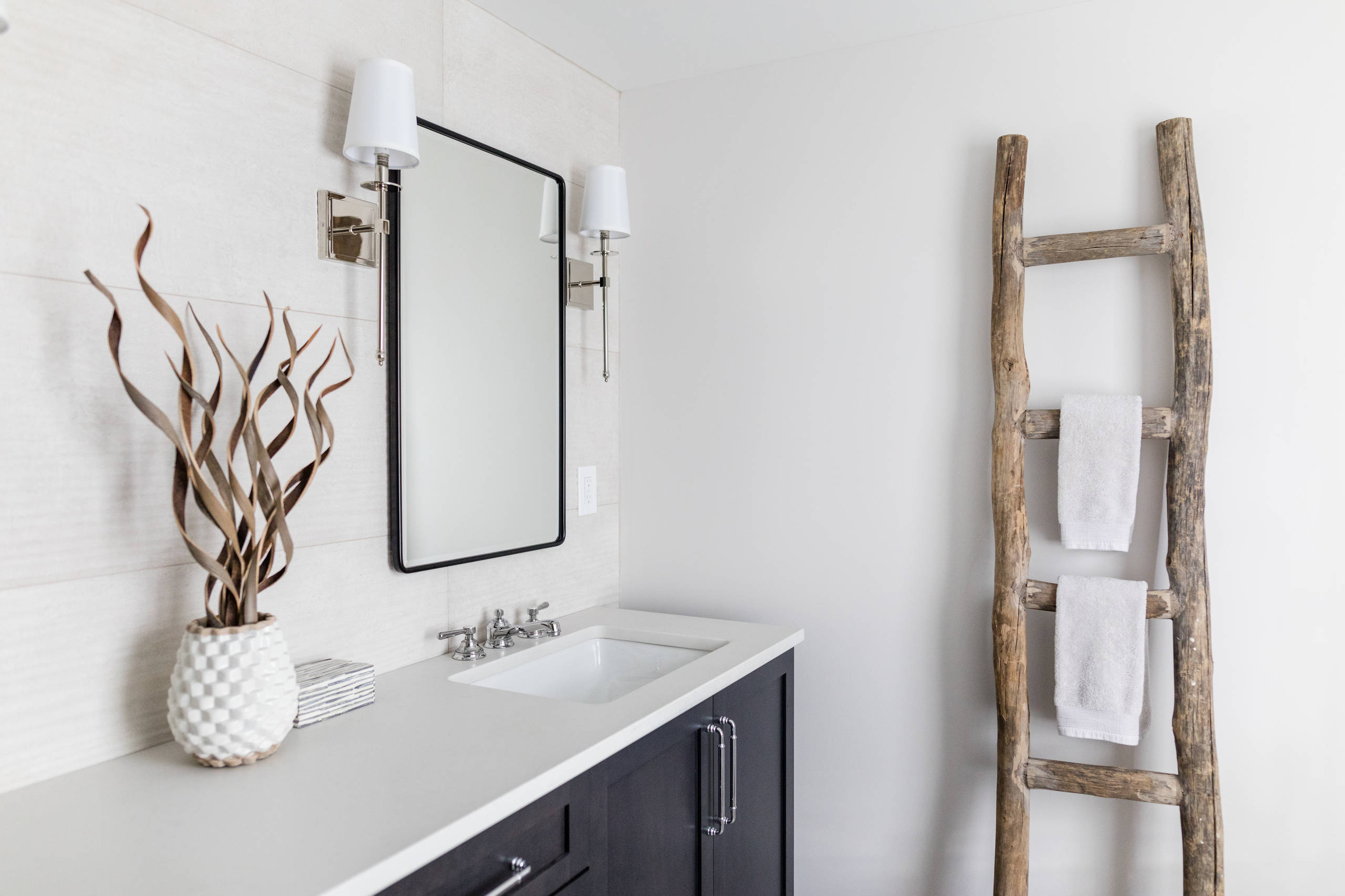 Example of a mid-sized cottage master white tile and porcelain tile porcelain tile and multicolored floor corner shower design in Detroit with shaker cabinets, black cabinets, a two-piece toilet, gray