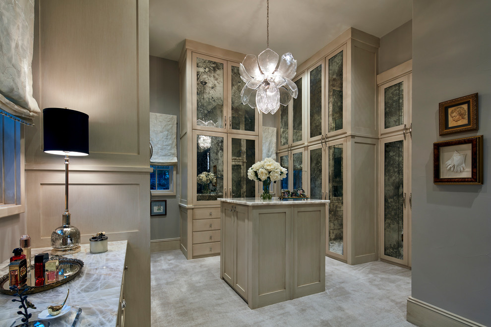 Expansive transitional women's walk-in wardrobe in Dallas with recessed-panel cabinets, beige cabinets, beige floor and carpet.