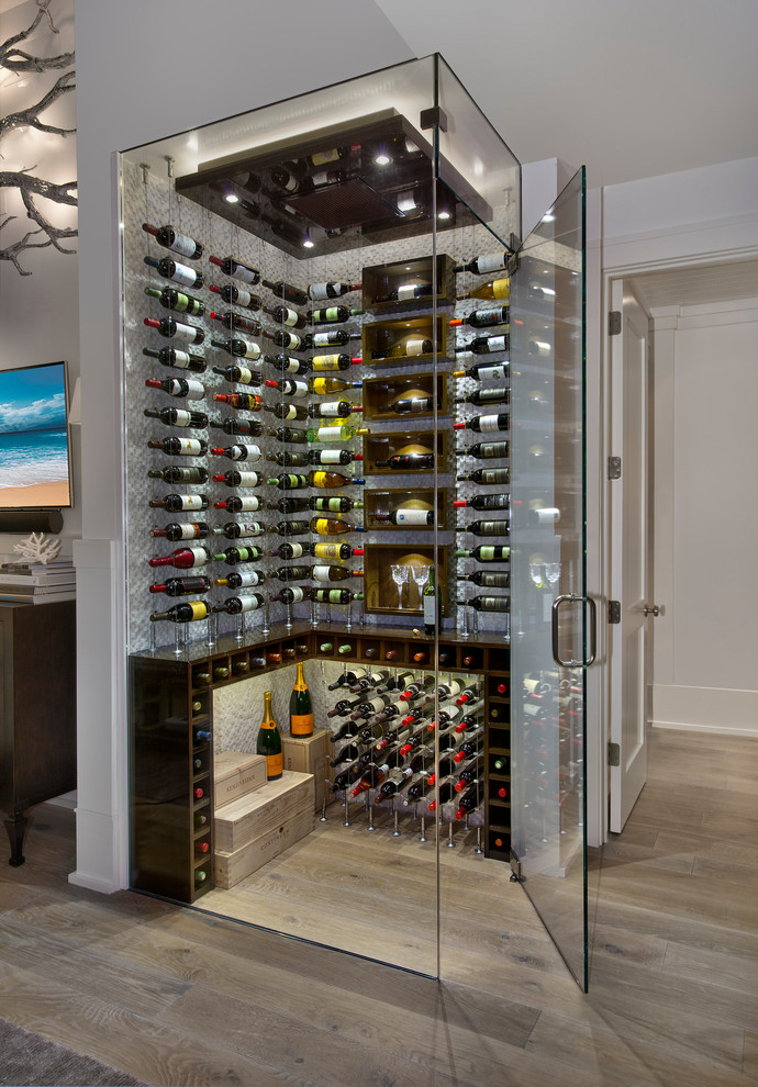 Design ideas for a contemporary wine cellar in Other with medium hardwood floors, display racks and brown floor.
