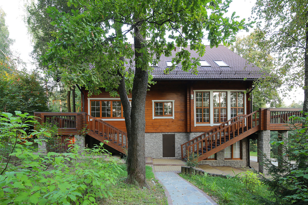 Дом из клееного бруса с цокольным этажом и американской террасой