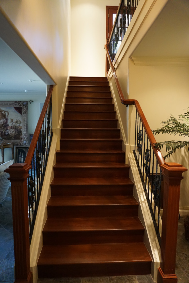 Inspiration for a medium sized traditional wood straight mixed railing staircase in Denver with wood risers.