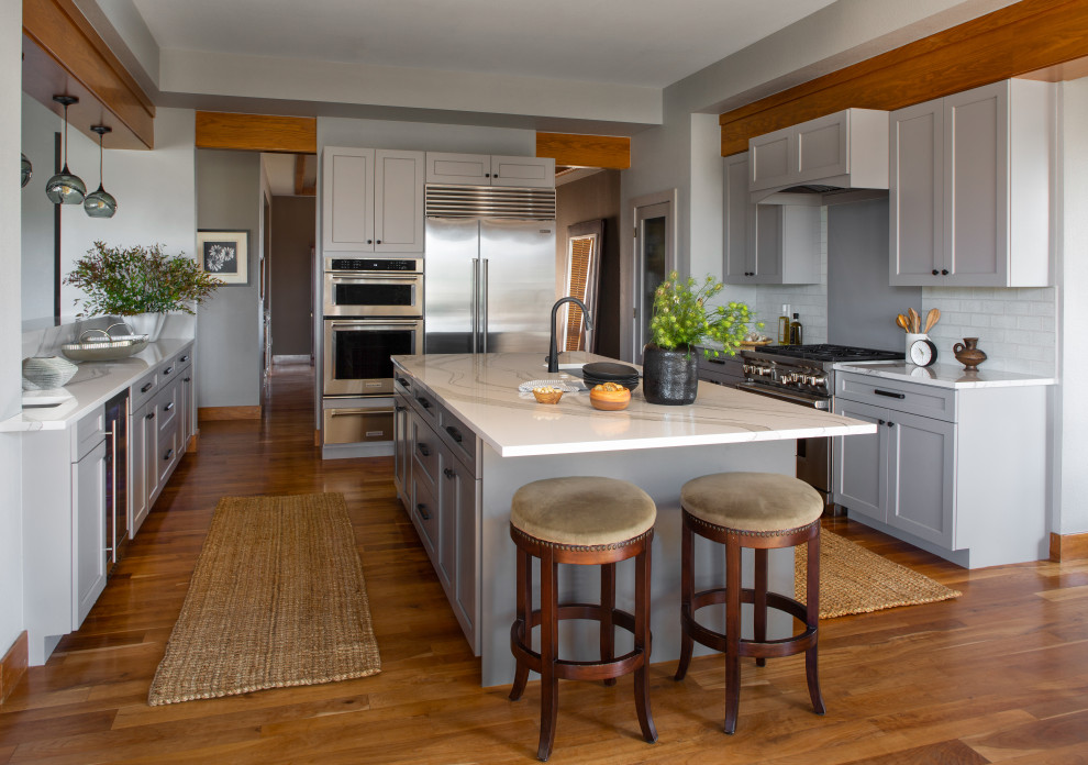 Example of a transitional kitchen design in Denver