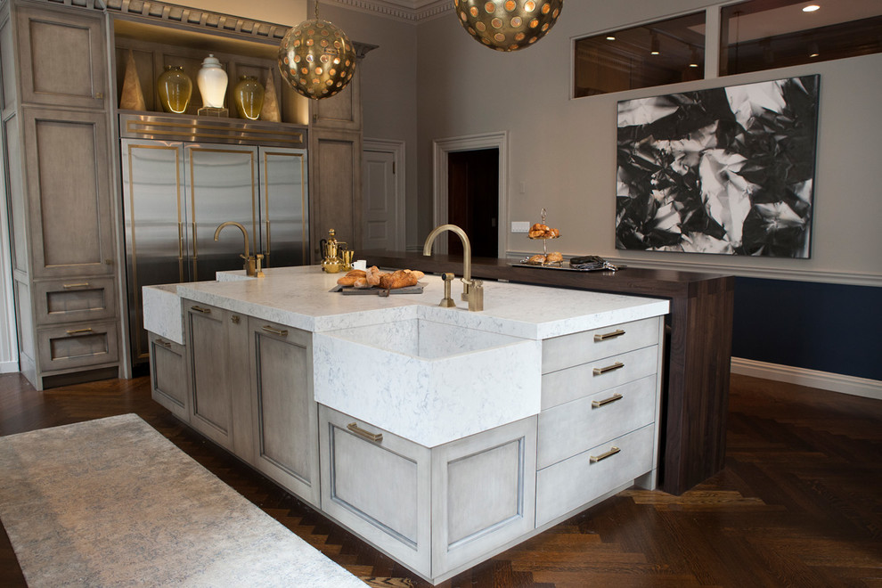 Minimalist kitchen photo in Other with an integrated sink, quartz countertops and an island