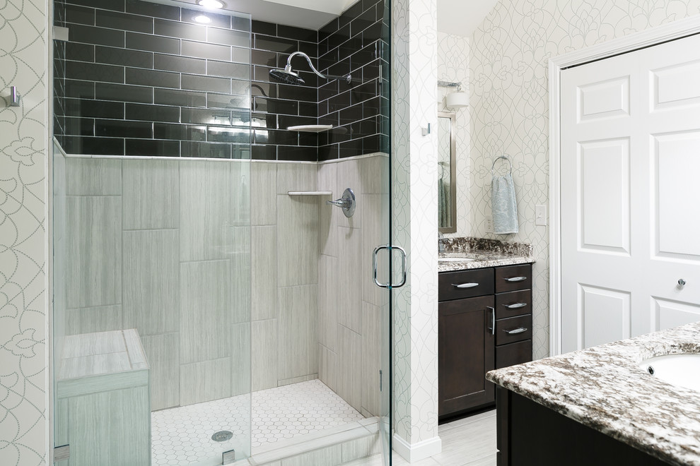 Inspiration for a mid-sized traditional master bathroom in Louisville with shaker cabinets, brown cabinets, an alcove shower, a one-piece toilet, multi-coloured tile, glass tile, multi-coloured walls, ceramic floors, an undermount sink and granite benchtops.