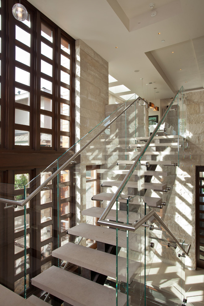 Mid-sized contemporary concrete l-shaped staircase in San Francisco with open risers.