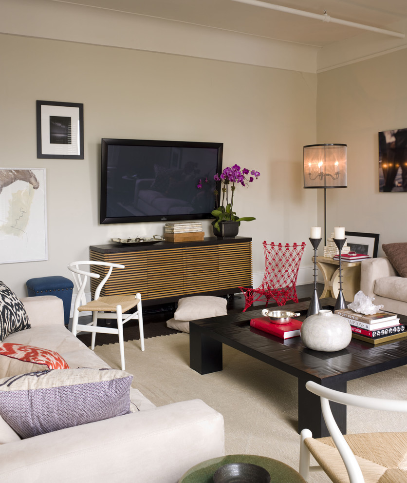 Design ideas for a contemporary living room in New York with beige walls and a wall-mounted tv.