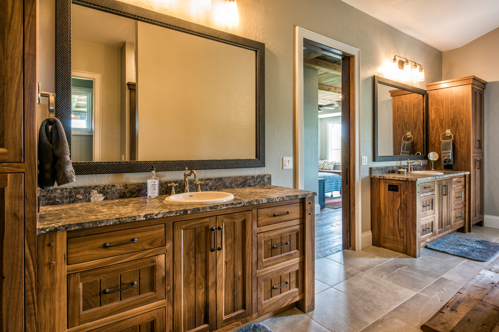 Example of a large mountain style master bathroom design with medium tone wood cabinets