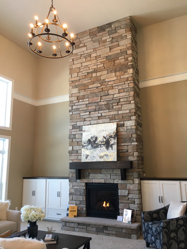 Large arts and crafts formal open concept living room in Other with beige walls, carpet, a standard fireplace, a stone fireplace surround and no tv.