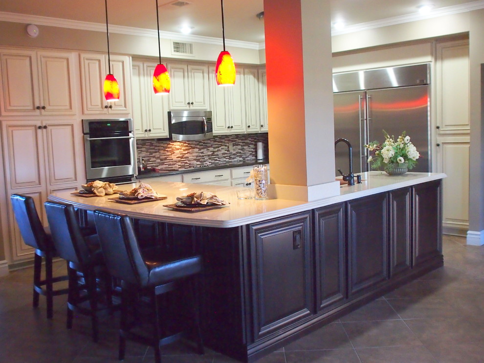 Large transitional cement tile floor and brown floor open concept kitchen photo in Phoenix with raised-panel cabinets, white cabinets, solid surface countertops, brown backsplash, matchstick tile backsplash, stainless steel appliances, an island and a farmhouse sink