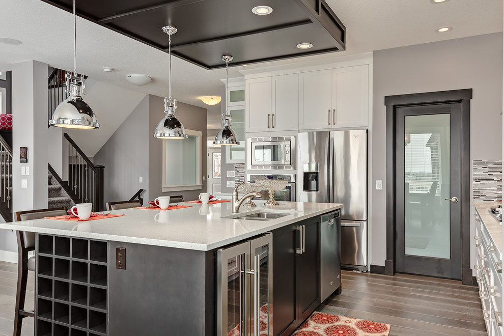 Example of a transitional kitchen design in Calgary