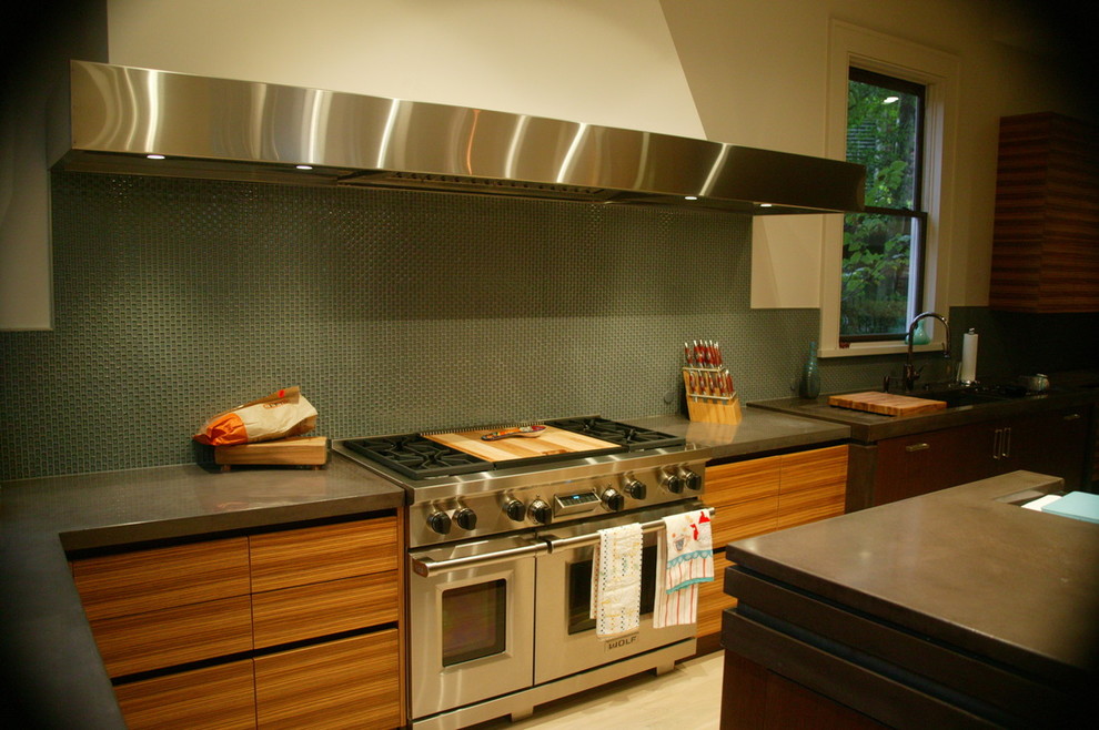 Inspiration for a mid-sized contemporary u-shaped light wood floor eat-in kitchen remodel in Charlotte with an undermount sink, flat-panel cabinets, medium tone wood cabinets, stainless steel appliances and an island