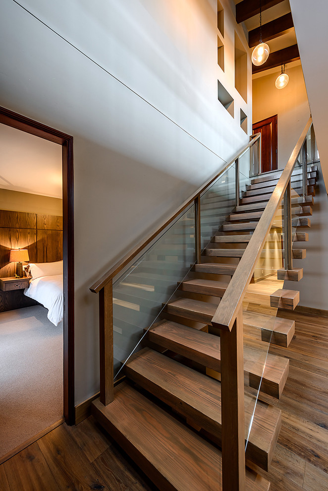 Inspiration for a contemporary straight staircase in Vancouver with open risers.