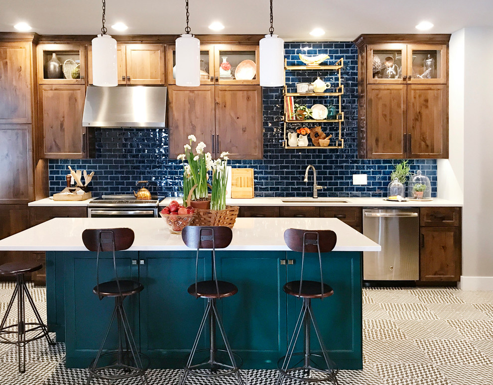 Inspiration for a mid-sized traditional kitchen in Other with an undermount sink, quartzite benchtops, blue splashback, subway tile splashback, stainless steel appliances, with island, multi-coloured floor, shaker cabinets and dark wood cabinets.