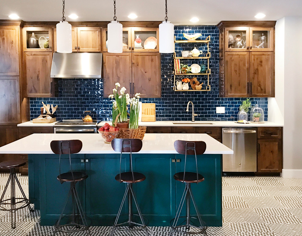 Inspiration for a mid-sized timeless multicolored floor kitchen remodel in Other with an undermount sink, quartzite countertops, blue backsplash, subway tile backsplash, stainless steel appliances, an island, shaker cabinets and dark wood cabinets