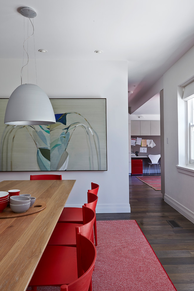 Inspiration for a contemporary dining room in Melbourne with white walls, medium hardwood floors and brown floor.