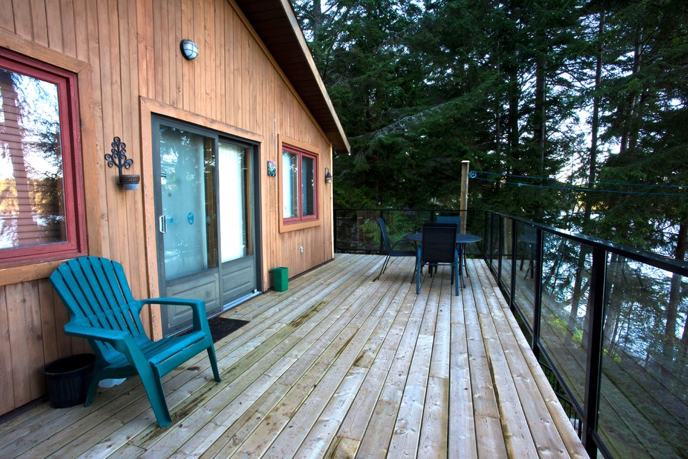 Deck - mid-sized rustic backyard balcony deck idea with no cover