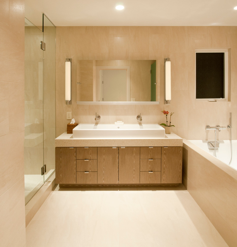This is an example of a large modern master bathroom in Los Angeles with a vessel sink, flat-panel cabinets, medium wood cabinets, engineered quartz benchtops, an alcove tub, an alcove shower, beige tile, porcelain tile and porcelain floors.