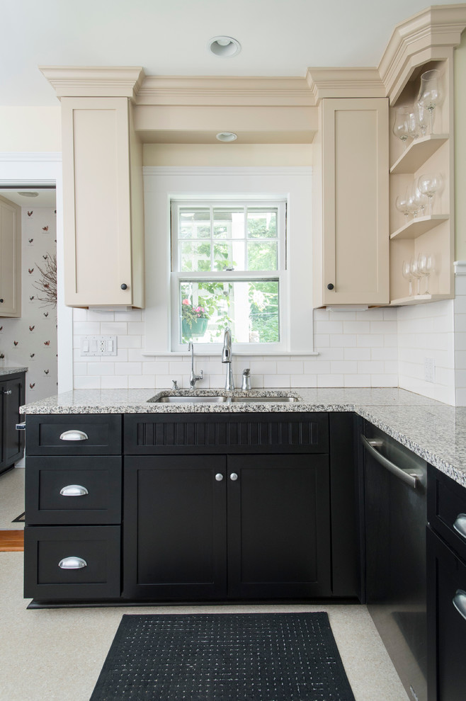 Photo of a mid-sized arts and crafts u-shaped separate kitchen in Boston with a double-bowl sink, recessed-panel cabinets, beige cabinets, granite benchtops, white splashback, subway tile splashback, stainless steel appliances, linoleum floors and a peninsula.