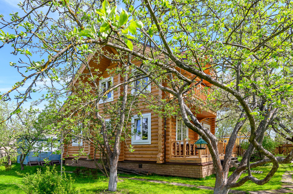 отделка дома из оцилиндрованного бревна