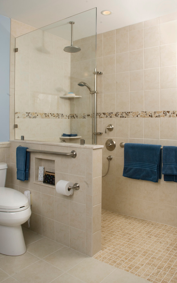 Design ideas for a mid-sized traditional 3/4 bathroom in Philadelphia with a one-piece toilet, blue walls, ceramic floors, a curbless shower, beige tile, black tile, gray tile and pebble tile.