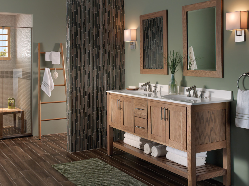 Alcove shower - large transitional master beige tile, brown tile, gray tile, multicolored tile and matchstick tile vinyl floor and brown floor alcove shower idea with shaker cabinets, medium tone wood cabinets, a two-piece toilet, green walls, an integrated sink, quartz countertops and a hinged shower door
