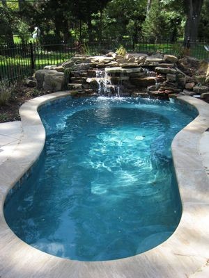 Inspiration for a traditional pool in Kansas City.