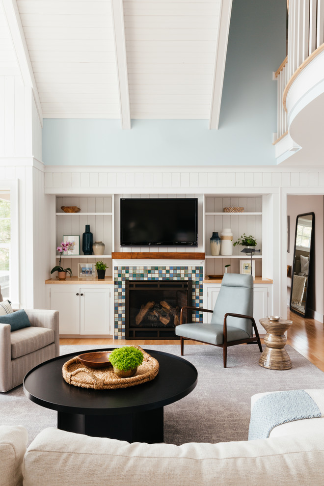 Inspiration for a large transitional open concept family room in Bridgeport with white walls, carpet, a standard fireplace, a tile fireplace surround and grey floor.