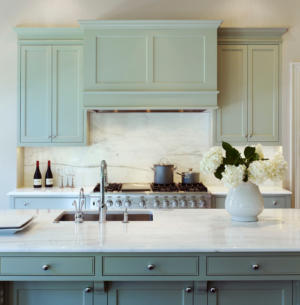 Traditional kitchen in DC Metro with an undermount sink, shaker cabinets, green cabinets and white splashback.