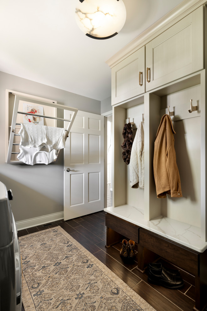 Mudroom - mid-sized traditional ceramic tile and brown floor mudroom idea in Minneapolis with gray walls