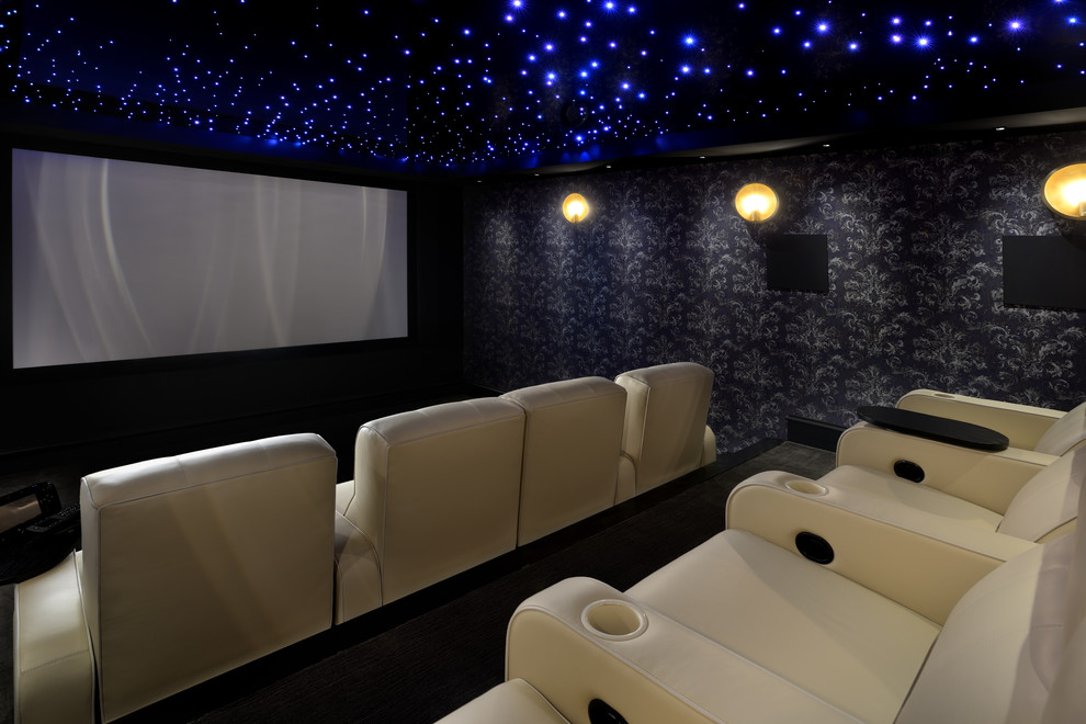 Photo of a transitional enclosed home theatre in Toronto with black walls, a projector screen and black floor.