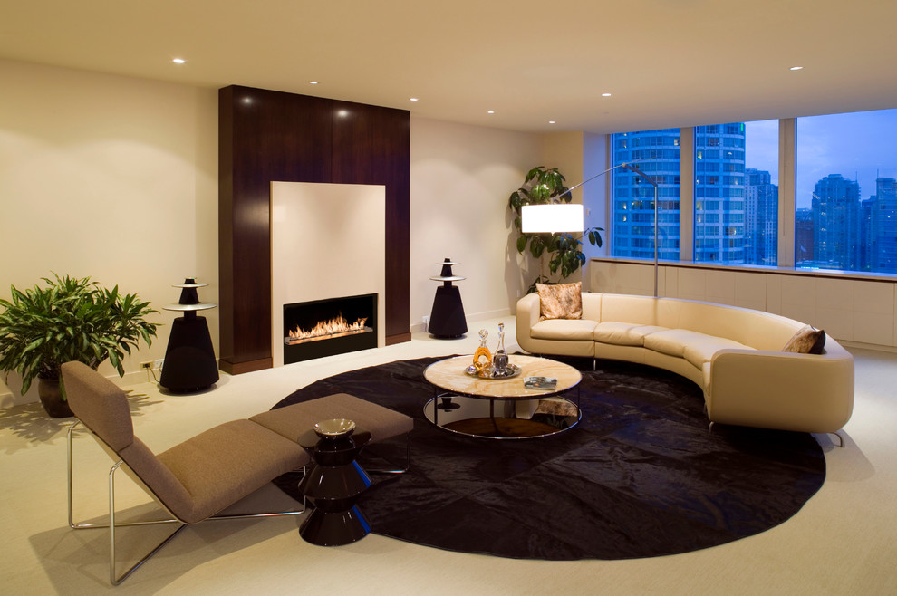 Photo of a large contemporary formal enclosed living room in Other with beige walls, carpet, a ribbon fireplace, a wood fireplace surround and no tv.