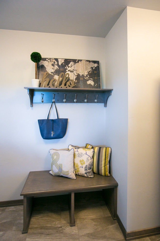 Inspiration for a large rustic vinyl floor mudroom remodel with gray walls