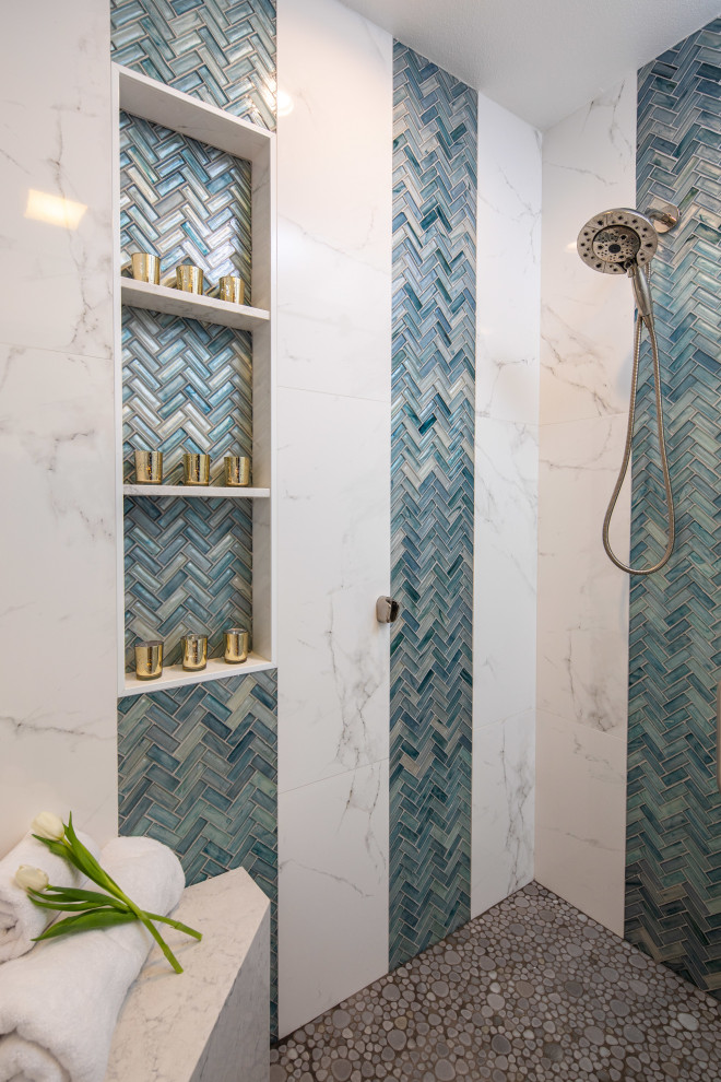 This is an example of a large master wet room bathroom in San Diego with flat-panel cabinets, dark wood cabinets, a one-piece toilet, blue tile, white walls, a vessel sink, engineered quartz benchtops, green floor, a hinged shower door and white benchtops.