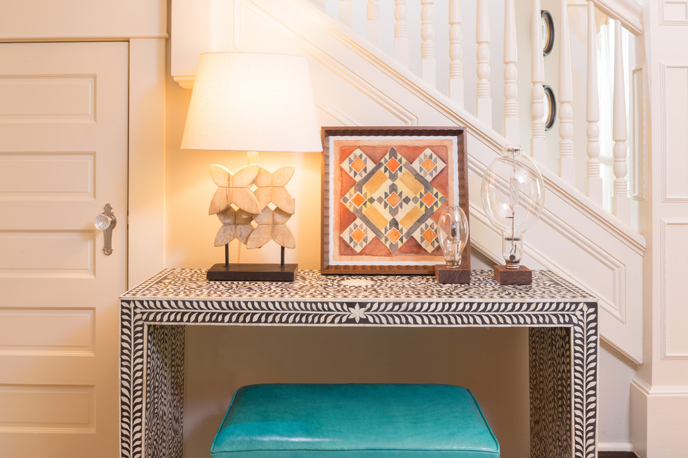 Mid-sized eclectic light wood floor foyer photo in Seattle with white walls