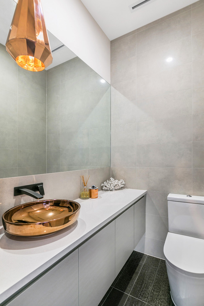 Photo of a small contemporary bathroom in Adelaide with flat-panel cabinets, white cabinets, white tile, ceramic tile, grey walls, ceramic floors, a vessel sink and granite benchtops.