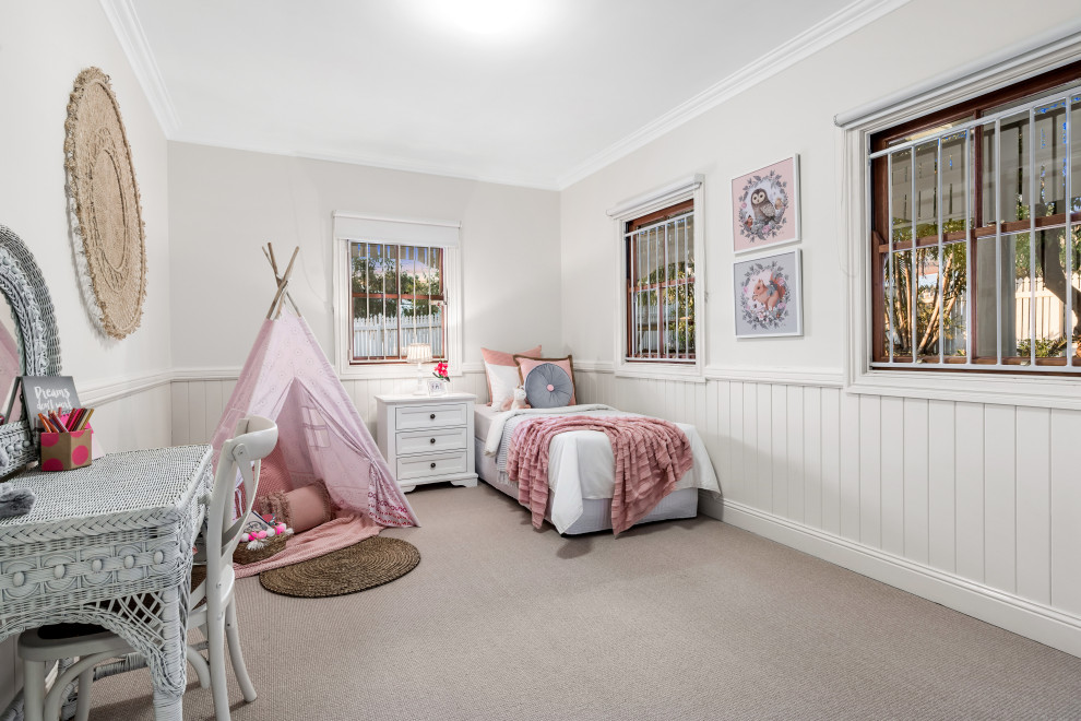 Design ideas for a beach style kids' room in Brisbane with decorative wall panelling.