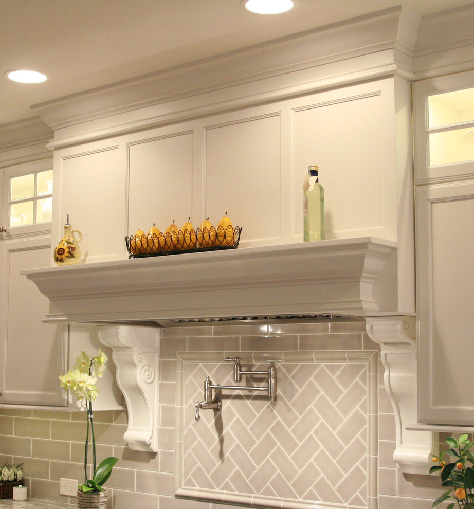 Large transitional l-shaped medium tone wood floor open concept kitchen photo in Cincinnati with an undermount sink, flat-panel cabinets, white cabinets, granite countertops, gray backsplash, subway tile backsplash, stainless steel appliances and an island