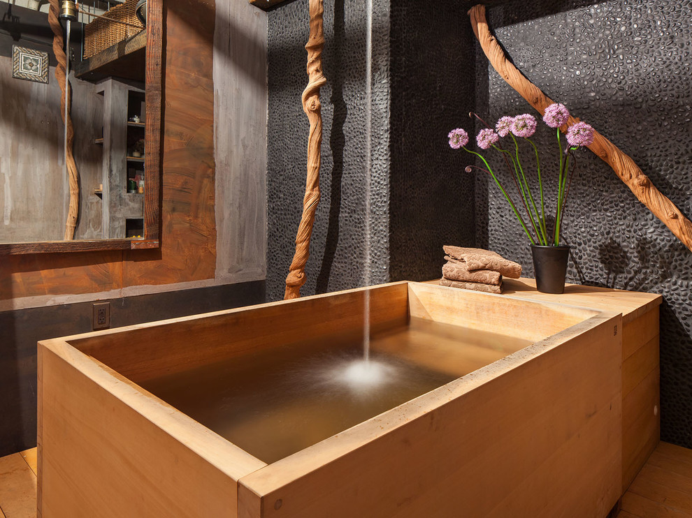 Inspiration for an asian bathroom in Portland with a japanese tub and a shower/bathtub combo.