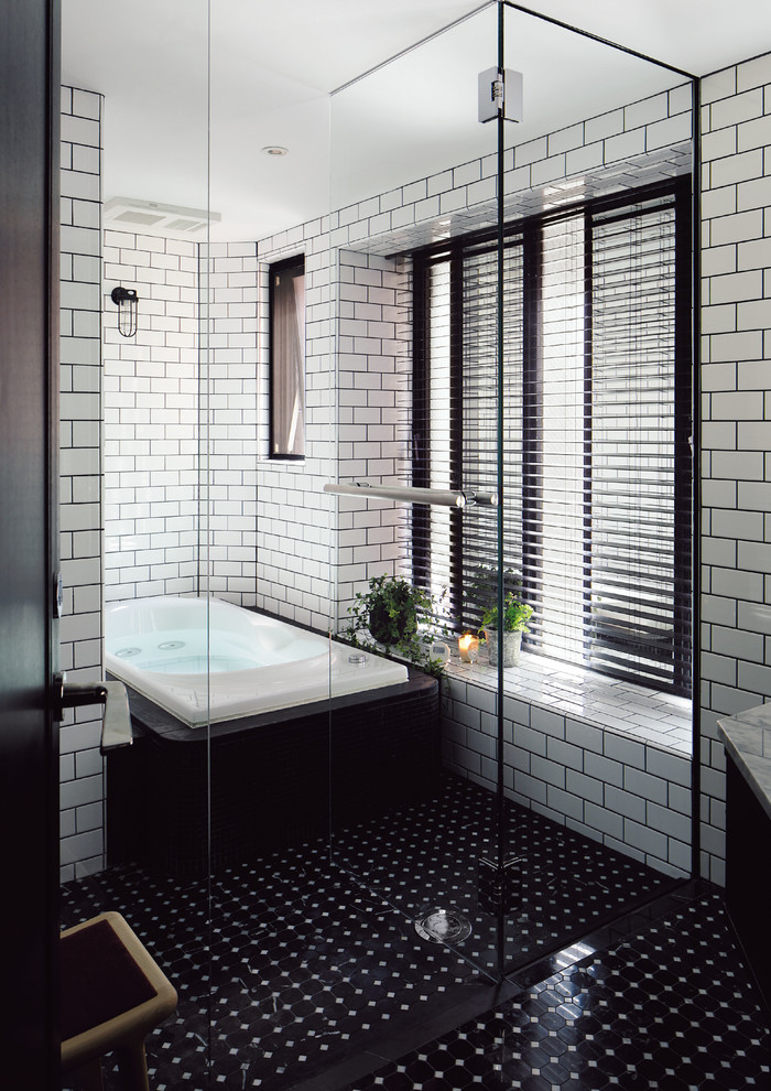 Contemporary bathroom in Other with white tile, subway tile, white walls and a hinged shower door.