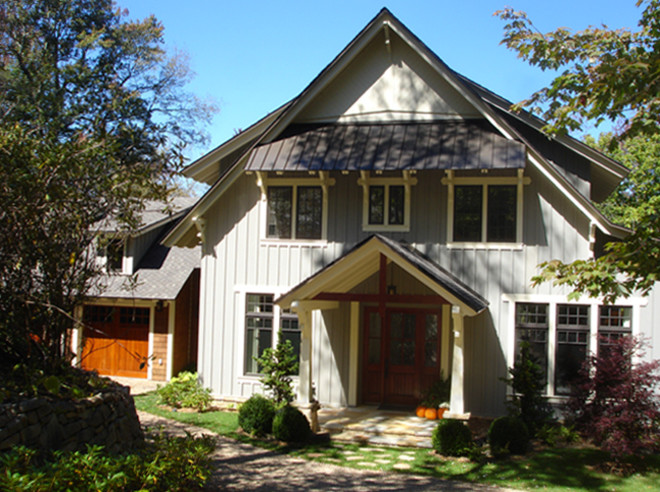 Photo of a large country two-storey blue exterior in Atlanta with wood siding and a gable roof.