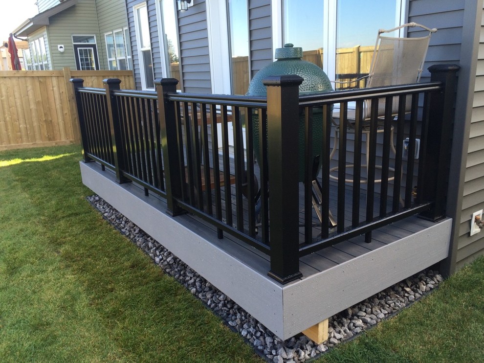 This is an example of a small contemporary backyard deck in Edmonton with no cover.