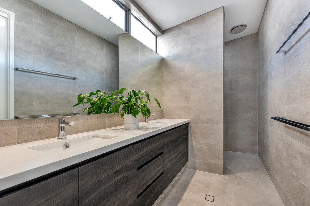 Photo of a mid-sized master bathroom in Perth with flat-panel cabinets, grey cabinets, a drop-in tub, an alcove shower, a two-piece toilet, mosaic tile, black walls, ceramic floors, a vessel sink, engineered quartz benchtops, an open shower and beige benchtops.