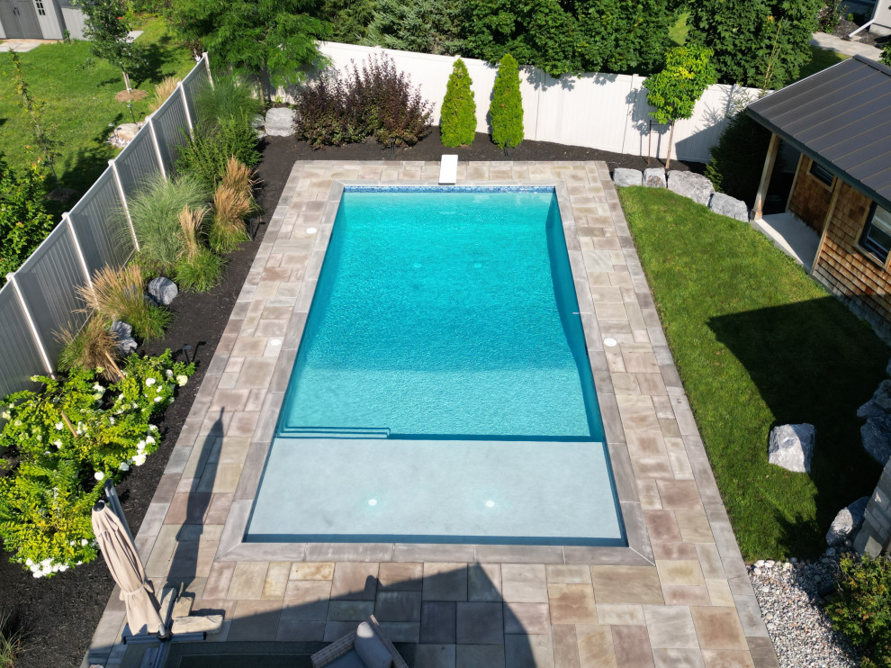 Backyard pool landscaping photo in Ottawa