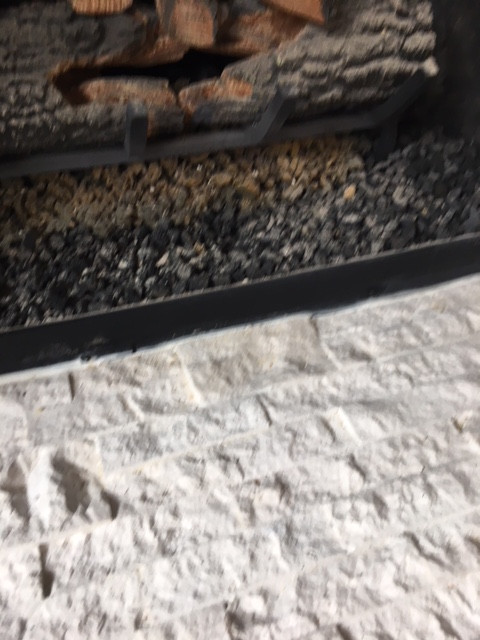 Stone Stacked on Fireplace & Kitchen Backsplash