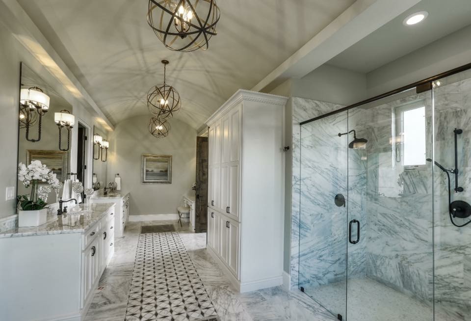 Photo of a large transitional master bathroom in Austin with shaker cabinets, white cabinets, an alcove shower, gray tile, white tile, stone slab, grey walls, marble floors, an undermount sink and granite benchtops.