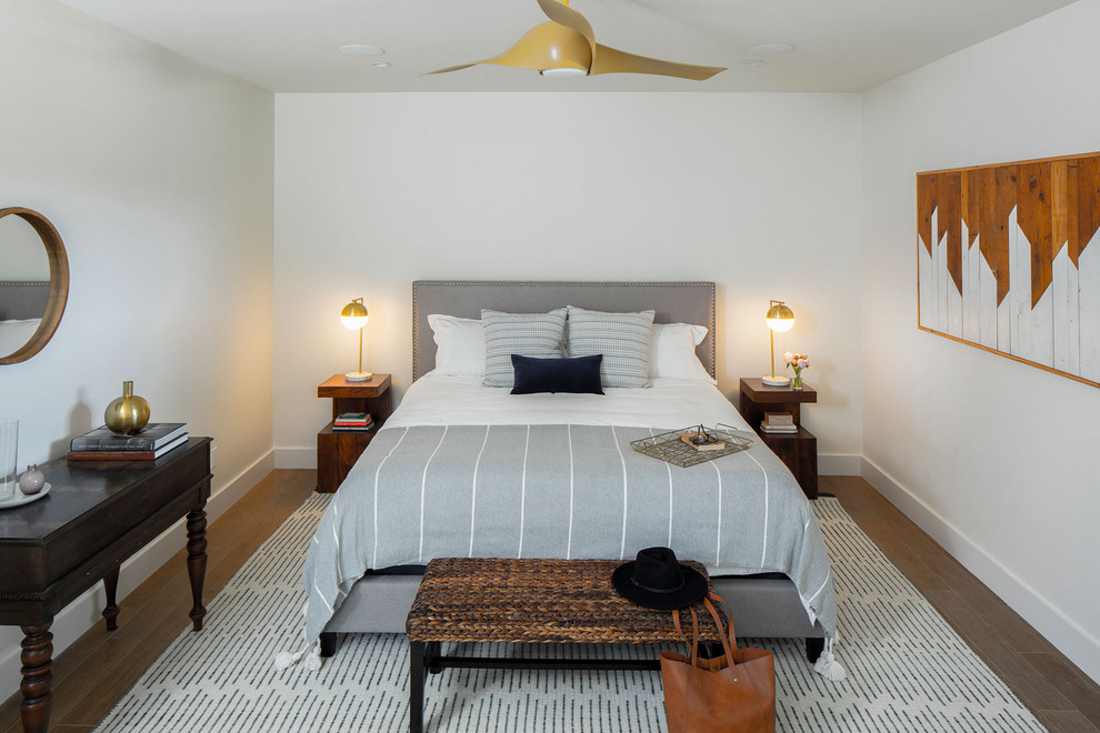 Inspiration for a mid-sized country guest bedroom in Austin with white walls and no fireplace.