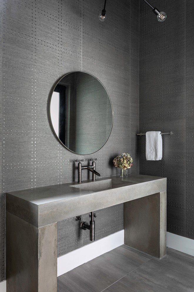 Photo of a contemporary bathroom in Houston with grey cabinets, grey walls, an integrated sink, grey floor and grey benchtops.