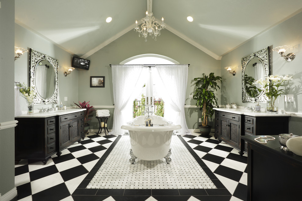 Traditional bathroom in Sacramento with recessed-panel cabinets, black cabinets and a claw-foot tub.