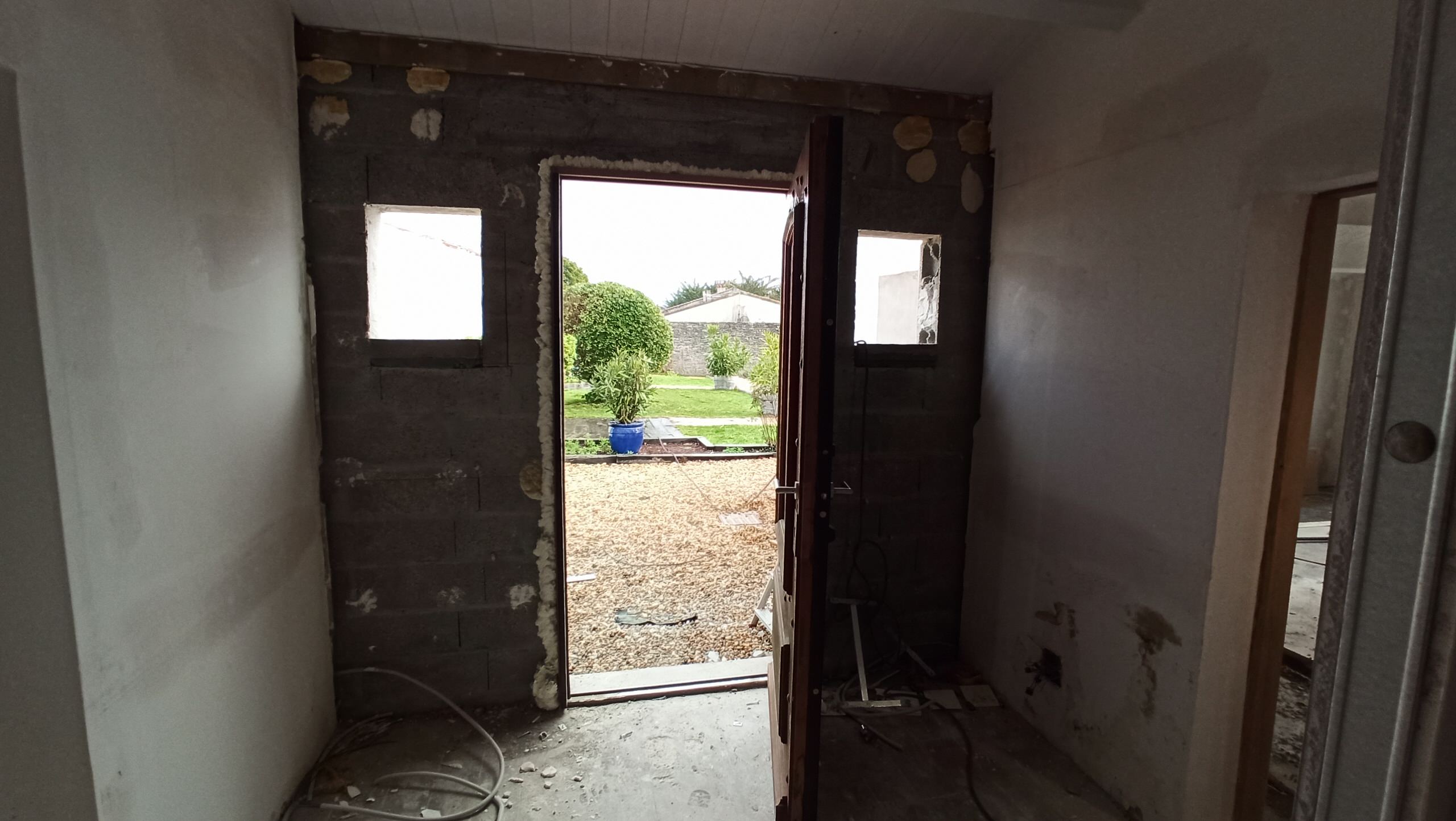 Transformation d'une chambre parentale en pièce de vie/cuisine