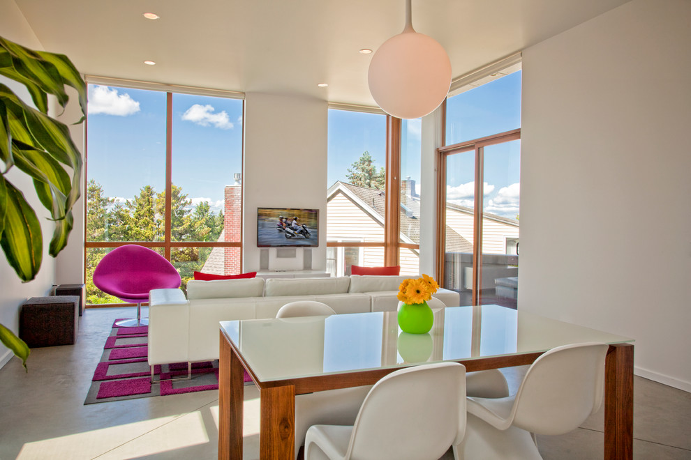 Photo of a contemporary open plan dining in Seattle with white walls.